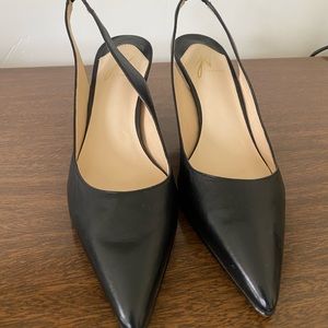Black leather Sling back kitten heels.